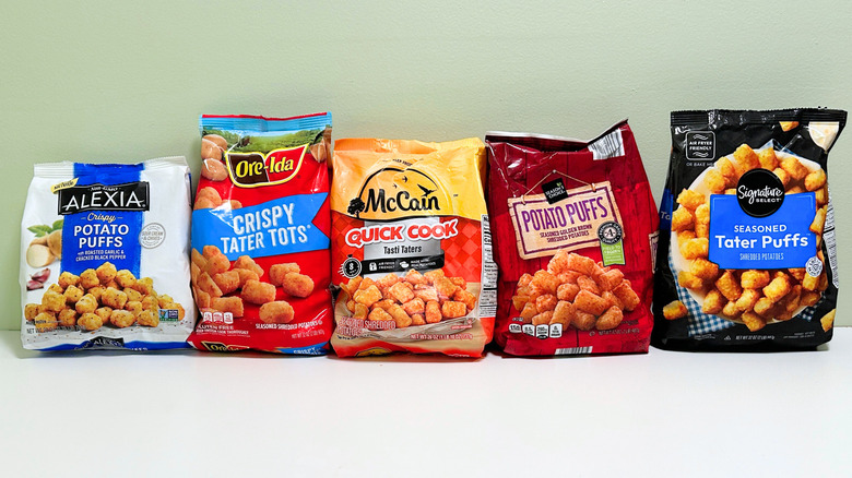 Five frozen tater tot options lined up against a wall