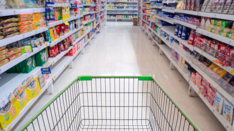 Shopping cart in a grocery aisle