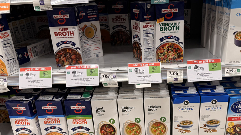 Aisle with BOGO tags on broth containers at Publix