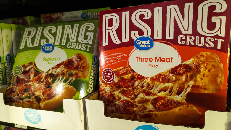 Great Value rising crust three meat pizza next to supreme pizza