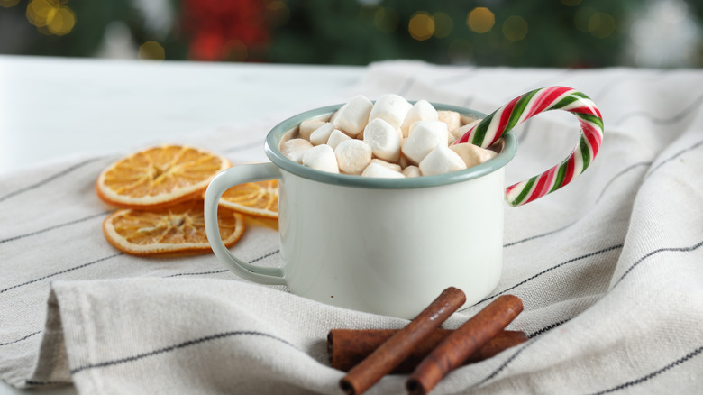 Mug of hot cocoa with candy cane
