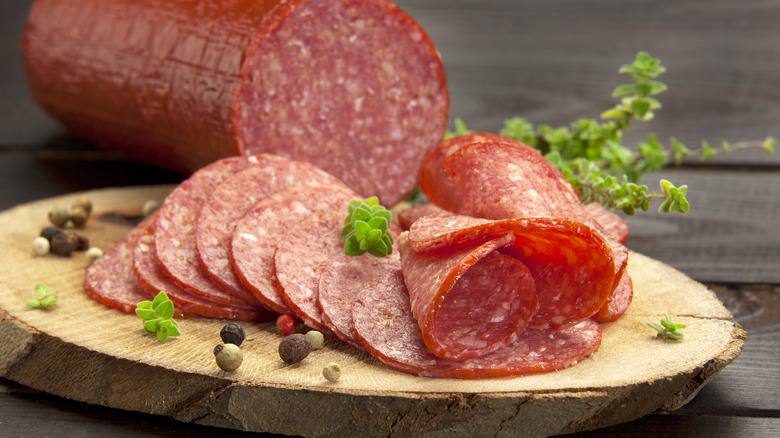 Sliced salami on a charcuterie board 