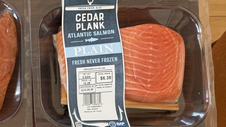 A salmon fillet with a cedar plank in Aldi packaging