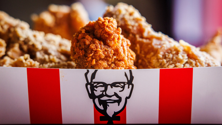 KFC fried chicken in an open KFC box featuring Col. Sanders