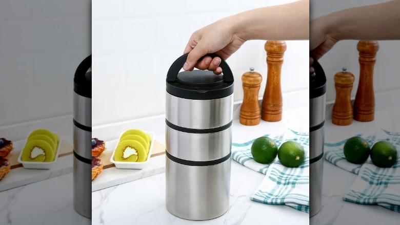 Mainstays stacked food jar on counter with hand