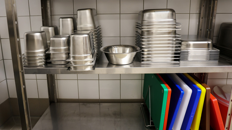 organized kitchen with color-coded cutting boards for safe food preparation