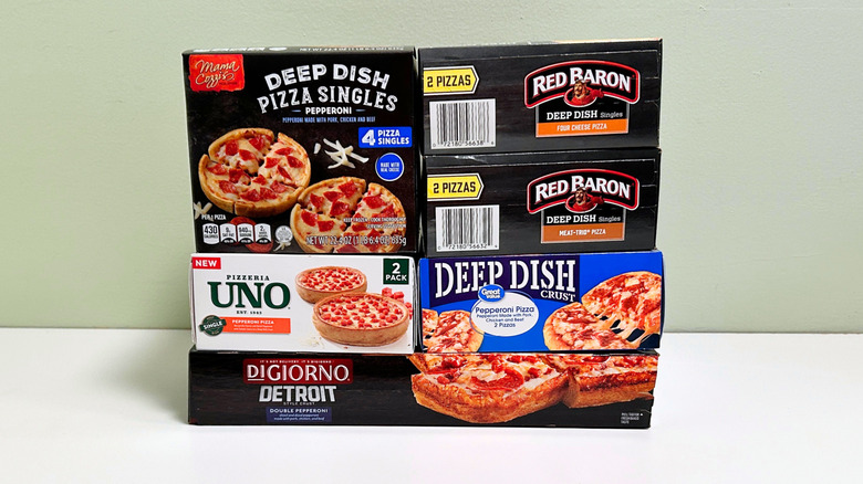 Six deep dish frozen pizzas stacked together