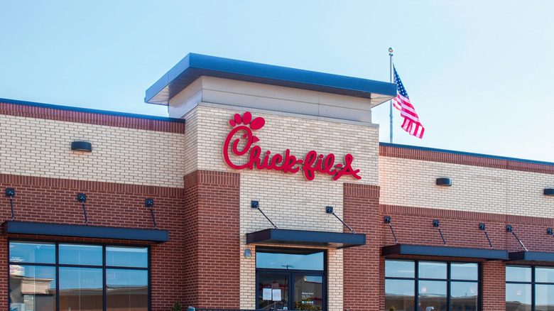 front exterior of Chick-fil-A restaurant with American flag