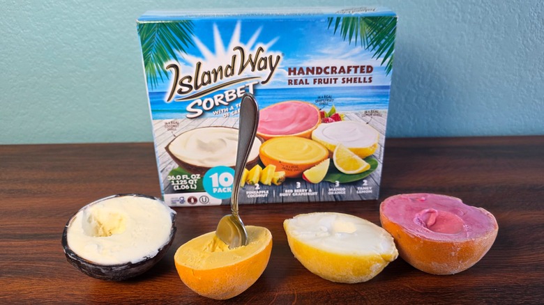 Island Way handcrafted assorted fruit sorbets box with fruit shells in front including one with a spoon