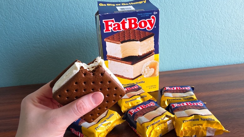 FatBoy premium vanilla ice cream sandwich box, individual packages, and sandwich in hand