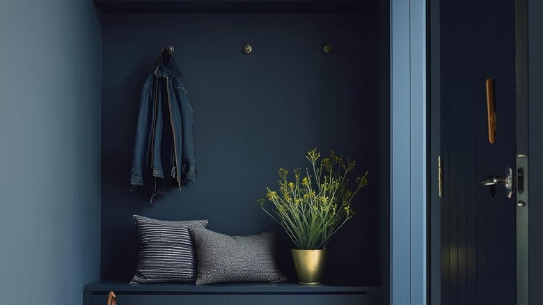Deep navy blue coat room painted with EVOLVE semi-gloss
