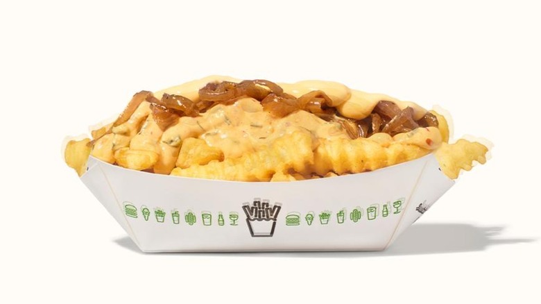 Shake Shack's West Coast Loaded Fries on a cream background