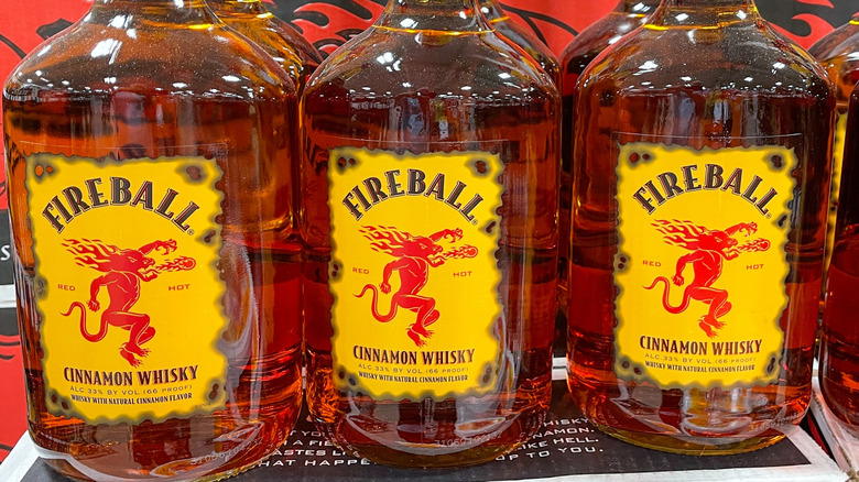 Two rows of three 1.75L bottles of Fireball Cinnamon Whisky