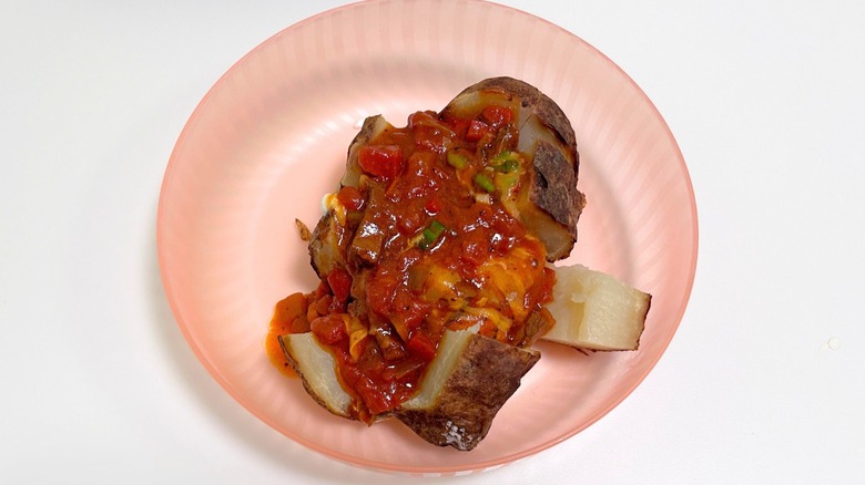 Close up of Outback Steakhouse secret menu Chili Cheese Baked Potato