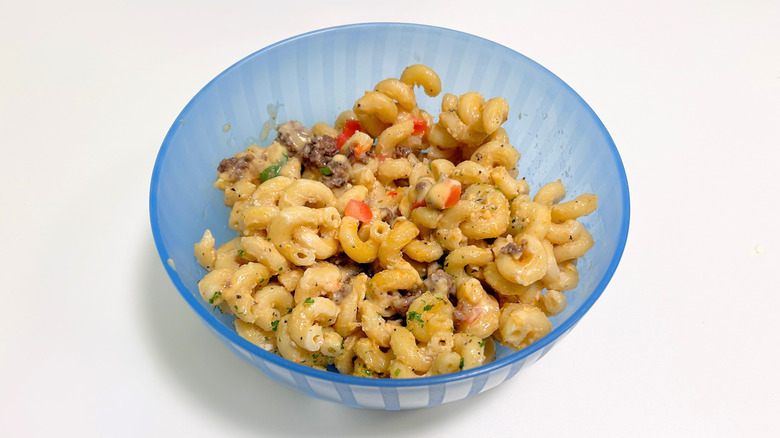 Close up of Outback Steakhouse secret menu Loaded Cheesesteak Mac and Cheese