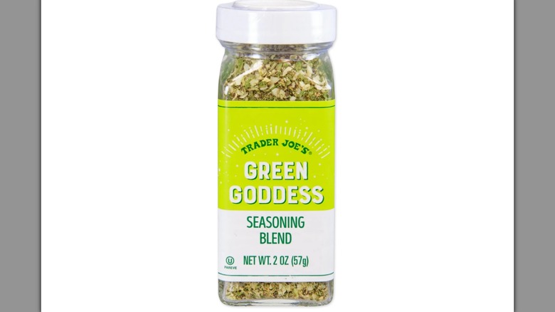 A bottle of Trader Joe's Green Goddess Seasoning Blend on a white background
