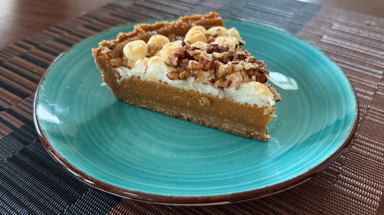 Slice of sweet potato pie from Whole Foods Market, topped with marshmallows and pecans