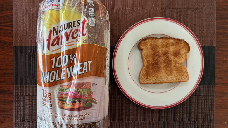 Nature's Harvest 100% whole wheat loaf and toasted slice with butter on plate