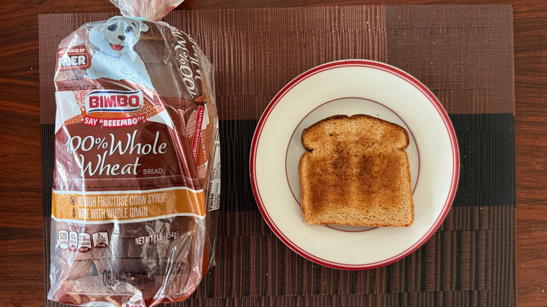Bimbo 100% whole wheat loaf and toasted slice with butter on plate