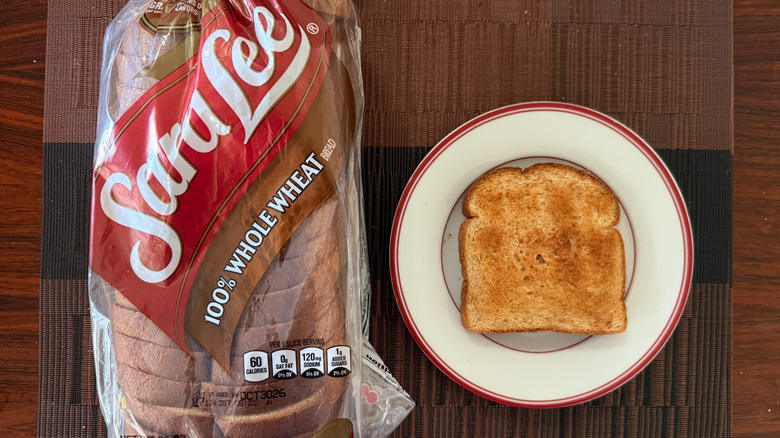 Sara Lee whole wheat loaf and toasted slice with butter on plate