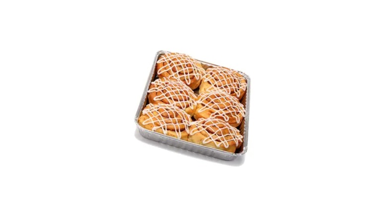 A pan of six IKEA cinnamon buns on a white background