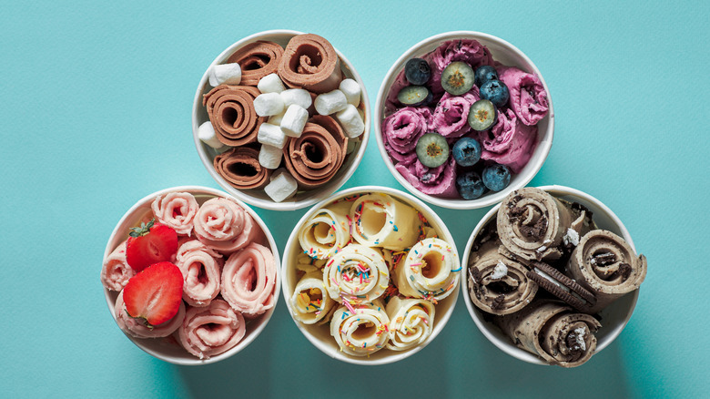 Bowls of different rolled ice cream flavors