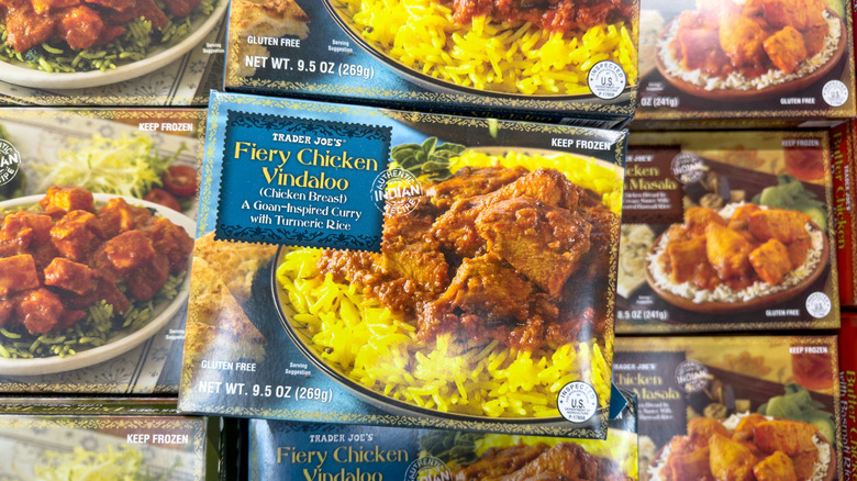 overhead view of a selection of frozen Trader Joe's items including Fiery Chicken Vindaloo and Chicken Tikka Masala