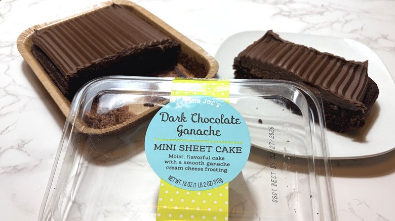 A chocolate mini sheet cake in a package and sliced on a plate