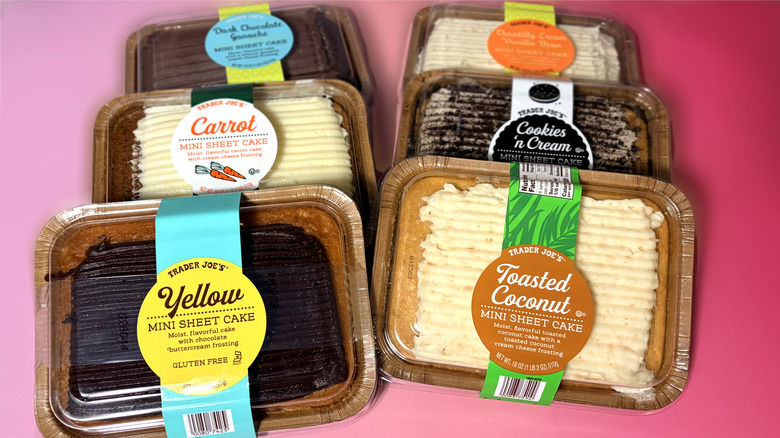 Six packaged Trader Joe's mini sheet cakes arranged on a table