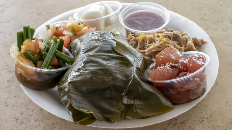A plate of lau lau and side dishes