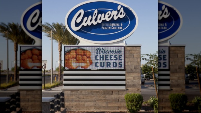 An exterior Culver's sign with a big screen display advertising Wisconsin cheese curds