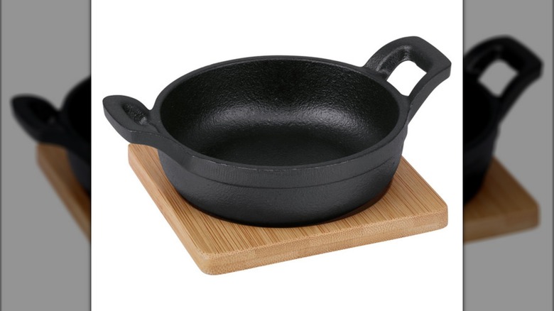 Crofton Cast Iron Mini Cookware Skillet on a wooden trivet