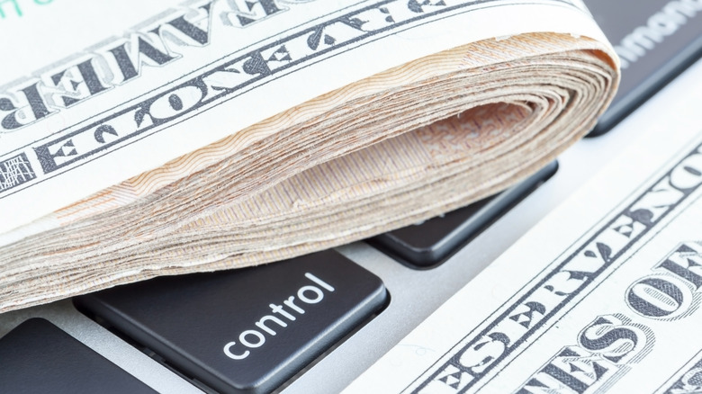 Folded money on computer keyboard