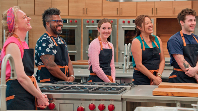 America's Test Kitchen smiling cooks in the kitchen