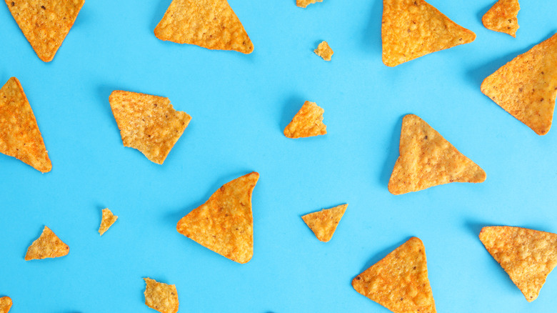 Nacho chips on blue background