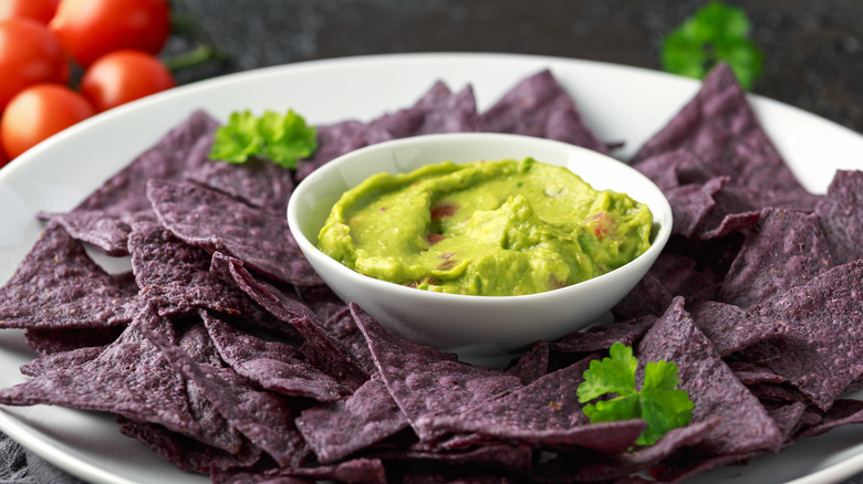 Blue corn tortilla chips with guacamole