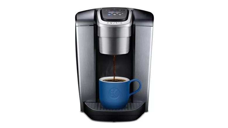 Keurig K-Elite Single Serve machine with coffee pouring into a blue mug
