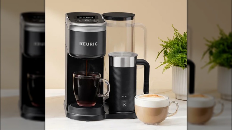 Keurig K-Supreme Plus machine with a full mug of coffee and a latte