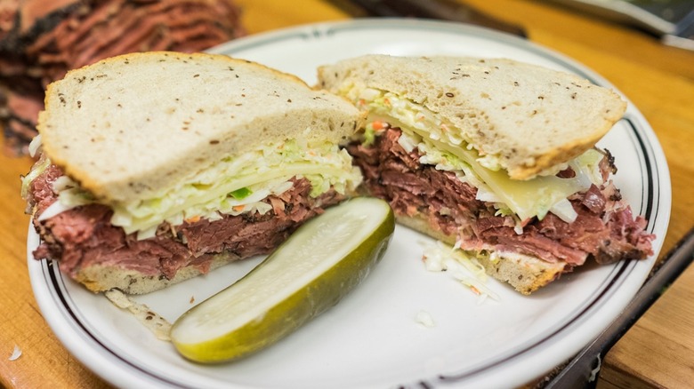 The #19 pastrami sandwich on rye bread on a plate from Langer's Deli