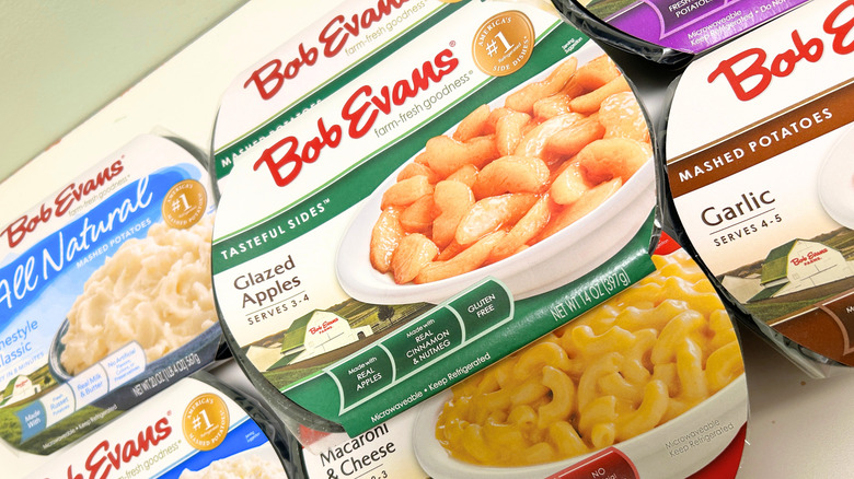 Several Bob Evans pre-made side dishes piled together on a white surface