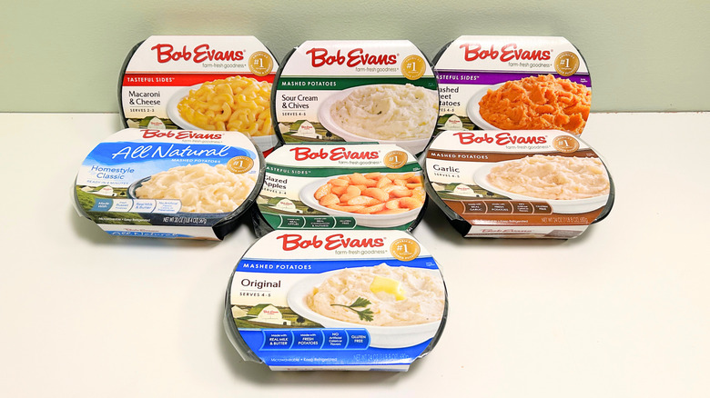 Seven Bob Evans store-bought side dishes together on a green and white background