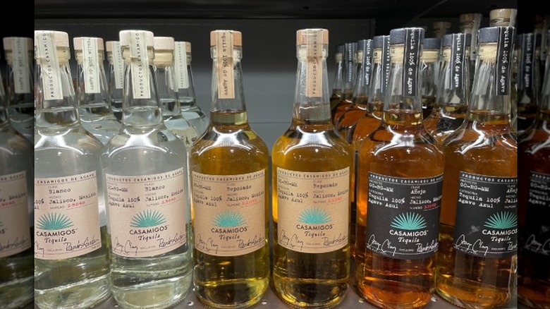 Casamigos Blanco, Reposado, and Añejo tequilas on the shelf in a store