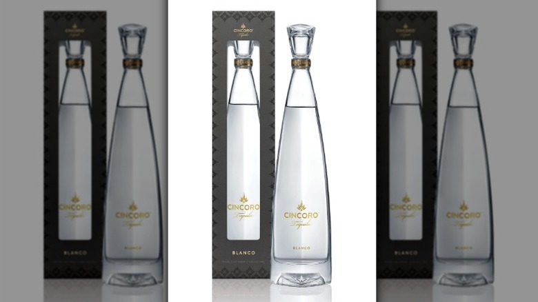 A bottle of Cincoro Blanco Tequila with its box