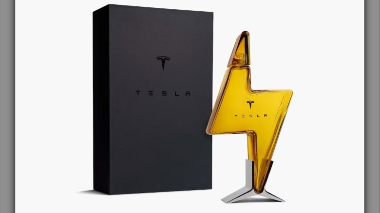 A bottle of Tesla Tequila next to its box