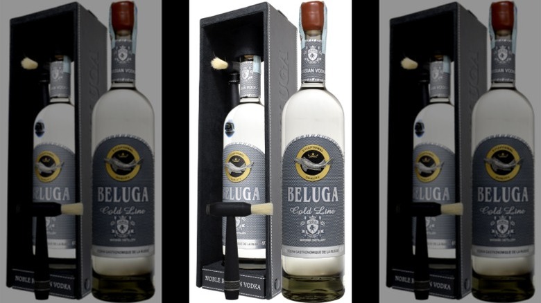 A bottle of Beluga Gold Line Vodka in its case with included brush