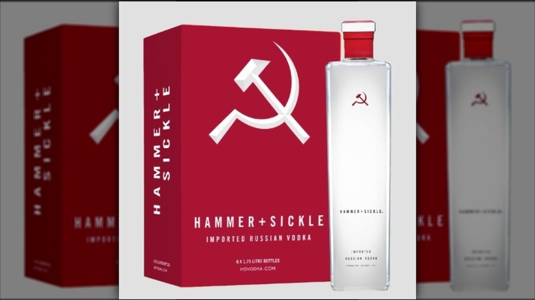 A bottle of Hammer & Sickle vodka next to a case
