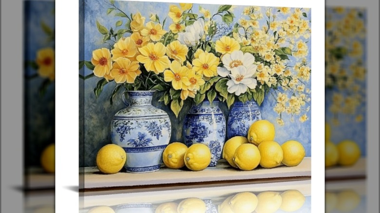 A painting of yellow flowers in blue and white vases surrounded by lemons