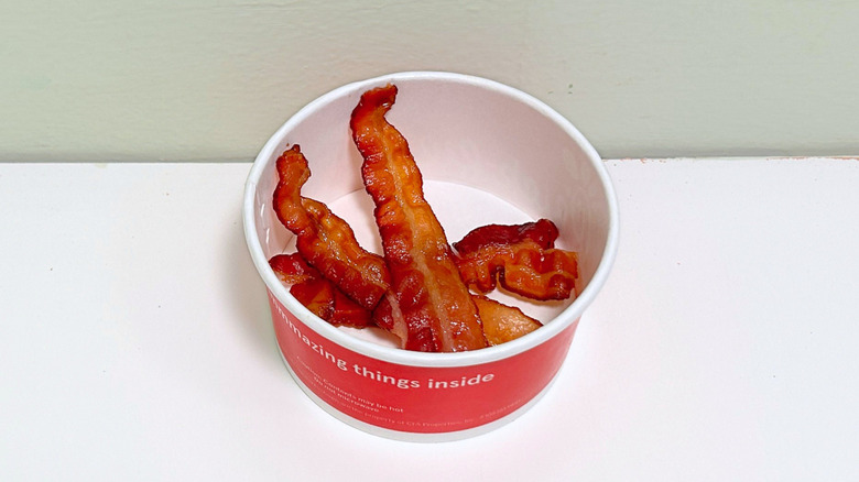 Three pieces of bacon in a bowl from Chick-fil-A