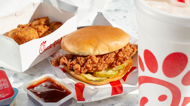 Chick-fil-A meal with sandwich, drinks, and nuggets