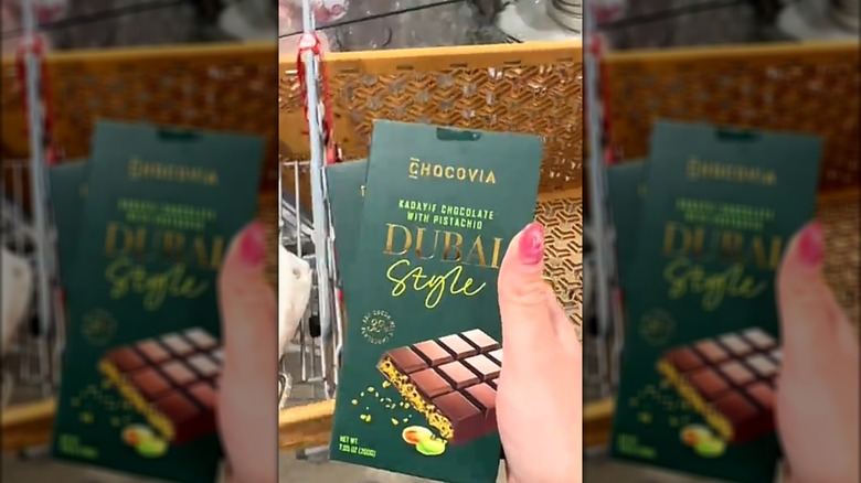 Hand holding a bar of Chocovia dubai style chocolate